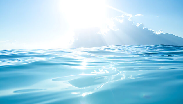 Bright sun rays piercing through clouds over calm turquoise ocean water, shimmering surface with light reflections, peaceful summer day, clean nature.