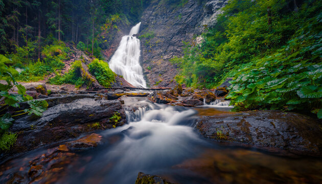 Dramatic summer view of Bride's Veil (Valul Miresei) Waterfall. Fabulous morning scene of Apuseni Natural Park, Cluj County, Romania, Europe. Beauty of nature concept background.