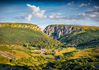 Fototapeta premium Marvelous morning view of Cheile Turzii (Turzii's Gorge) canyon, large natural preserve with marked trails for scenic gorge hikes crossing streams and bridges. Beauty of nature concept background.