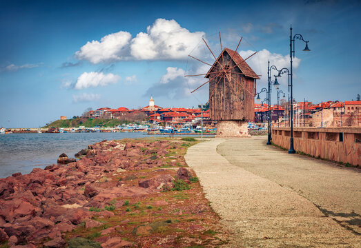 Marvelous afternoon scene of Old Town of Nessebar with wooden windmill. Impressive summer scene of Bulgaria, Europe. Traveling concept background.