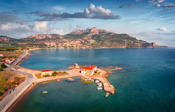 Sunny summer view of Kardamyli port. Superb morning seascape of Ionian sea. Impressive outdoor scene of Peloponnese peninsula, Greece. Traveling concept background.