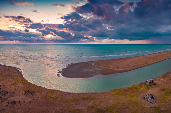 Dramatic evening seascape of Adriatic sea. Stunning summer view from flying drone of sunset on Semanit beach. Gorgeous outdoor scene of Albania, Europe. Vacation concept background.