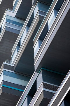 Glass balcony lines highlight modern residential architecture on a Paris France facade with refined detail and sleek urban precision