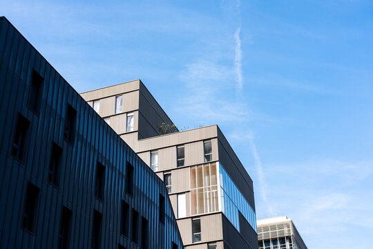 Clean angles define a modern residential architecture facade against urban Paris France sky in a refined exterior minimal composition