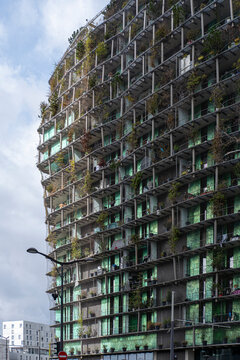 Vertical tower architecture with greenery across a modern residential facade brings urban Paris France a striking ecological skyline