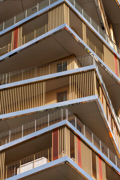 Bold balcony lines and geometry shape a modern residential architecture facade in urban Paris France with layered apartment visual rhythm