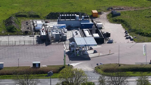 High angle view of a semi truck refueling at a modern hydrogen filling station, showcasing the future of sustainable transportation and clean energy infrastructure for heavy duty vehicles