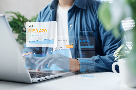 Business analytics dashboard overlay showing MRR growth, revenue performance and financial data insights on laptop screen, clean modern workspace, ideal for SaaS, fintech and digital marketing concept