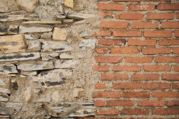 Fototapeta premium Exposed brick and stone wall restoration texture vintage background construction