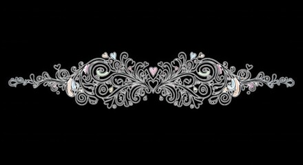 Symmetrical silver filigree ornament with swirling floral scrolls, intricate vine patterns, and small pastel heart accents on a black background