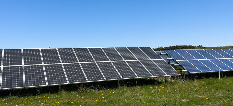 solar panels on a green field banner design