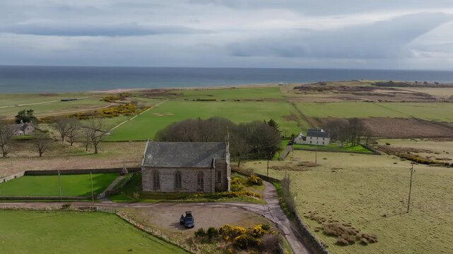 New Loth Burial Ground in Scotland with Coastal Landscape and Historic Church in Rural Countryside Setting