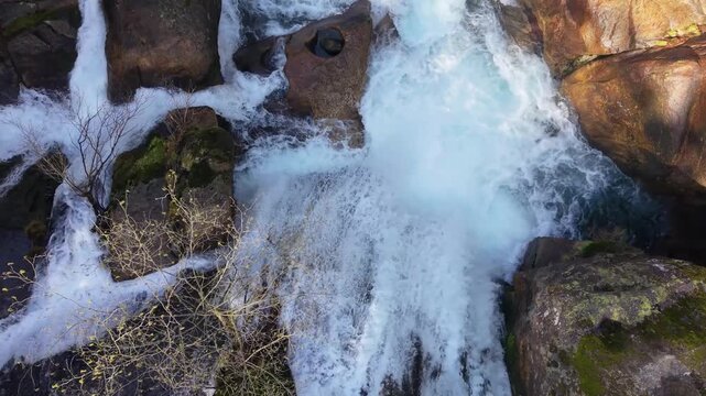 Crashing Waterfalls From Steep Mountains At Fervenza das Hortas In Dombod&aacute;n, Galicia, Spain. Aerial Drone Shot