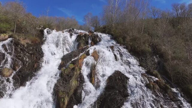 Powerful Waterfalls Of Fervenza das Bra&ntilde;as In Toques, Galicia, Spain. Aerial Tracking Shot
