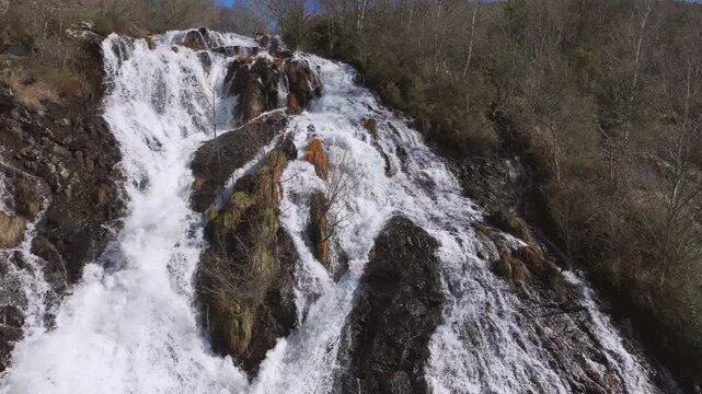 Rushing Waterfalls Over Rocky Mountains At Furelos River In Toques, Galicia, Spain. Aerial Rotate Shot