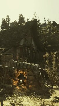 A soft glow emanates from a lantern resting near a crumbling stone wall. The enchanting cottage, surrounded by earthy tones, evokes a sense of nostalgia and simplicity.