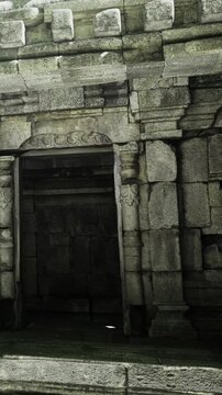 Weathered stone columns stand strong amidst the remnants of an ancient temple, showcasing intricate carvings and providing a glimpse into a bygone era of craftsmanship and devotion.