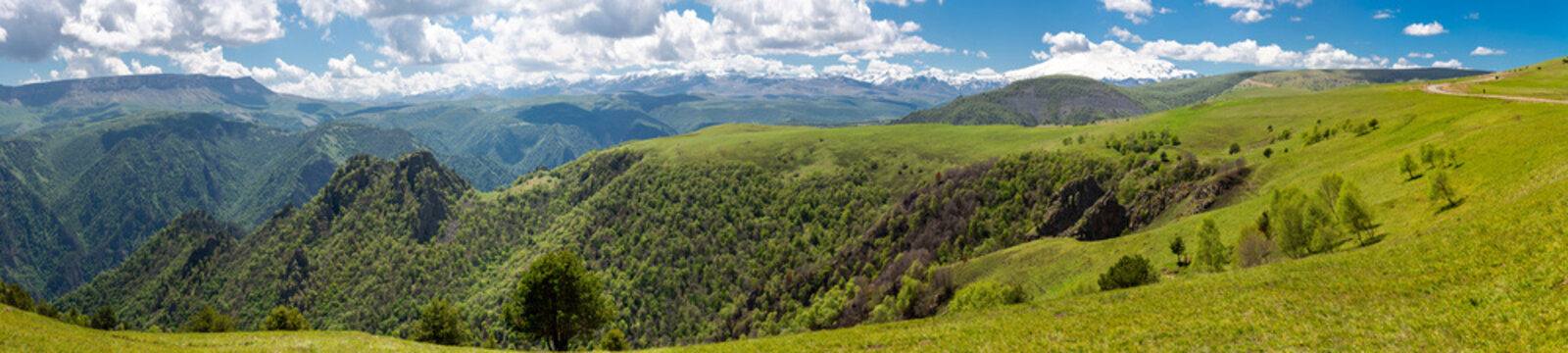 Panoramic view of snow-capped mount Elbrus and foothills in Caucasus mountains