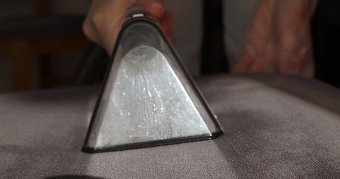Steam cleaner removes dirt from fabric for deep upholstery care