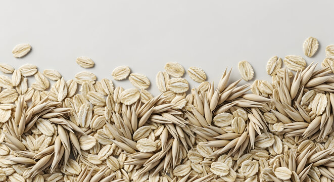 Wheat grains and seeds scattered on a plain background with a textured surface