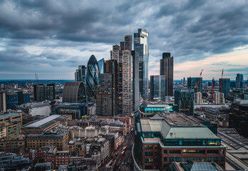 Fototapeta premium Panoramic aerial view of the illuminated City of London skyline with office skyscrapers and street traffic at Bishopsgate and Liverpool Street