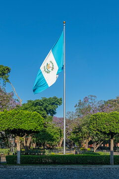 Guatemalan flag on the main square of Antigua, Guatemala.