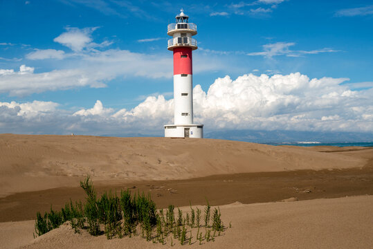 The Fangar lighthouse at the tip of the Punta del Fangar, Tarragona province, Catalonia, Spain