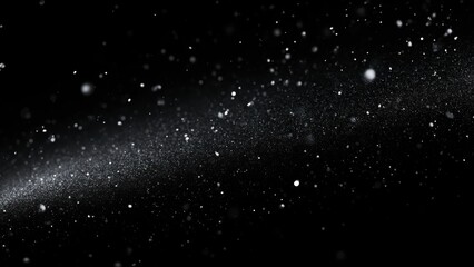 Fototapeta premium Mesmerizing glittering particles resembling cosmic dust or falling snow on a dark backdrop