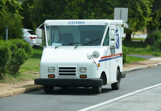 Wilmington, Delaware, U.S - May 2, 2026 - USPS mail truck parked on residential street with postal branding and identification number.