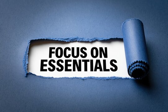 Focus On Essentials a minimalist principle revealed under a paper tear
