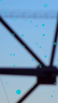 Vertical video: Camera pulling back, tower hub revealing powerline corridor, cyan dots mapping grid