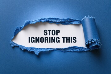 Naklejka premium Stop Ignoring This an urgent message revealed in a torn paper window
