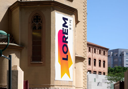 Vertical Urban Poster Mockup Template in Building facade