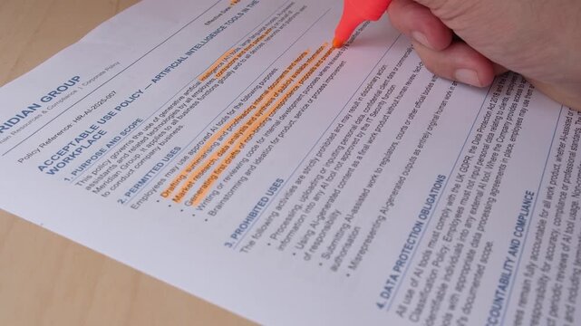 Closeup: Business person highlights bullet points on contract document