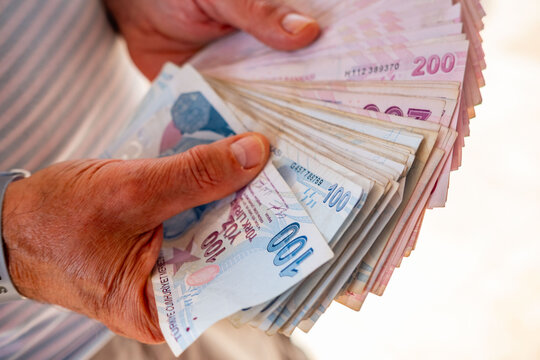 Male hands counting Turkish lira banknotes, economy, money payment, business deal, savings Turkish lira bills, financial background, economy and trade, savings concept, cash flow, real life moment