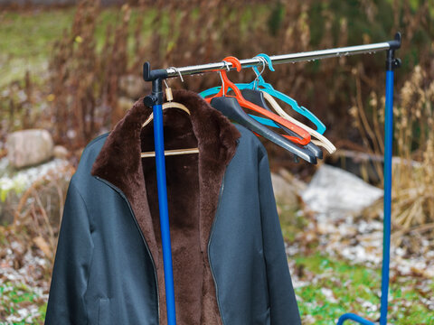warm jacket on a hanging rack