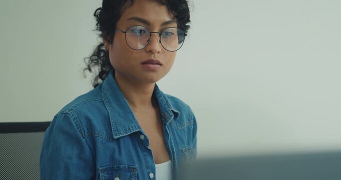 Close-up young professional African American female programmer coding AI software on screens in modern home office. Generative AI, machine learning, digital innovation, future technology concept.