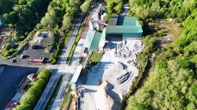 Aerial view of a concrete plant and quarry in a forest