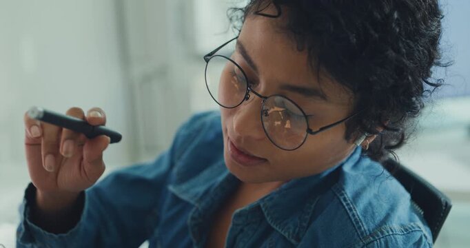 Close-up African American female robotics engineer discussing mechanical part on video call in laboratory. Remote work, virtual training, online meeting, future technology, technical support concept.