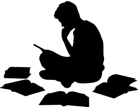 Silhouette of a boy sitting on the floor surrounded by books while studying or reading intently