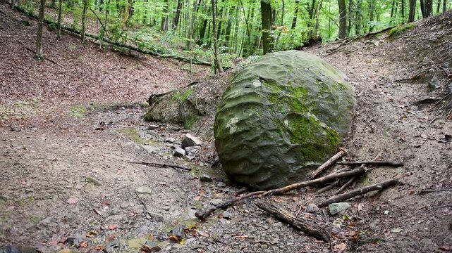 Stone sphere in village Slatina, Banja Luka is natural and archeological attraction in forest next to small rivulet