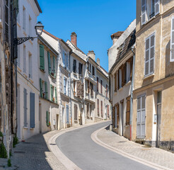 Obraz premium Chateau-Thierry, France - 05 01 2026: Chateau Street. Panoramic view of a typical street with sunny blue sky