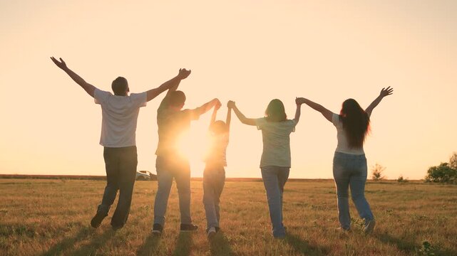 Mother father child kid run green meadow sunset, happy family, silhouette cheerful team group people, loving household steps forward as one beneath expansive evening sky., connection, parents and kids