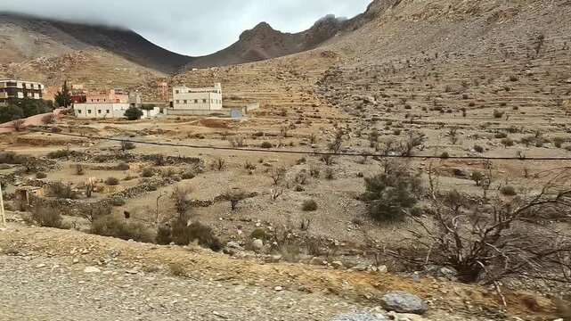 Scenic view of a traditional berber village nestled in the arid atlas mountains of morocco with its distinctive architecture