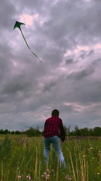 child playing kite sky background, children play outdoor nature, Dreams Taking Flight, Beautiful Landscape Kite Photo, Boy in Red Plaid Looks Up, Field of Wildflowers and Kites, Gentle Breeze and Open