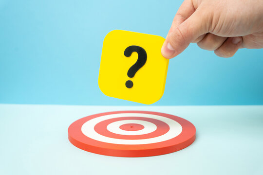 Question mark over the target. Concept of uncertainty, decision making, risk, unclear goals, strategy and problem solving in business and life planning.