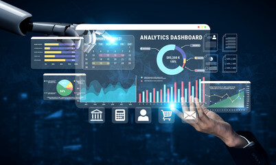 Fototapeta premium Futuristic Robotic Hand Interacting with Advanced Data Analytics Dashboard on Computer Screen in Modern Business Environment Haptic.