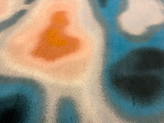 Fototapeta premium Water ripple random pattern of rug flooring, carpet flooring in blue, white, and orange red ripple pattern.