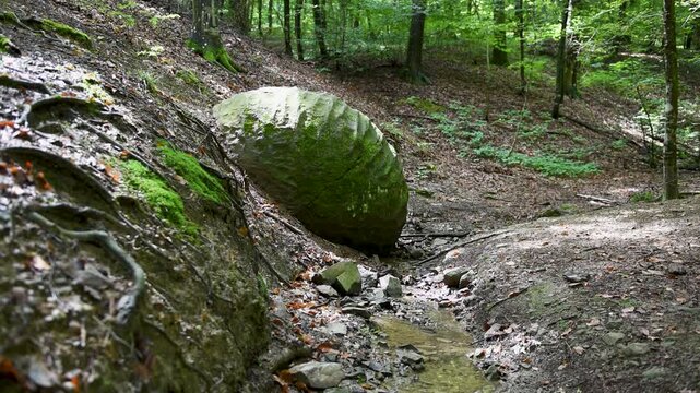 Stone sphere in village Slatina, Banja Luka is natural and archeological attraction in forest next to small rivulet