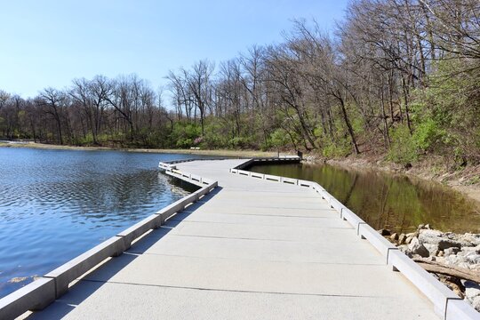The winding walkway at the lake on a sunny day.